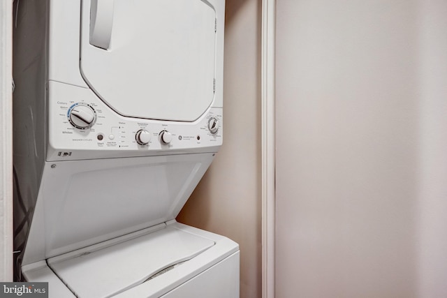 laundry area featuring laundry area and stacked washer / drying machine