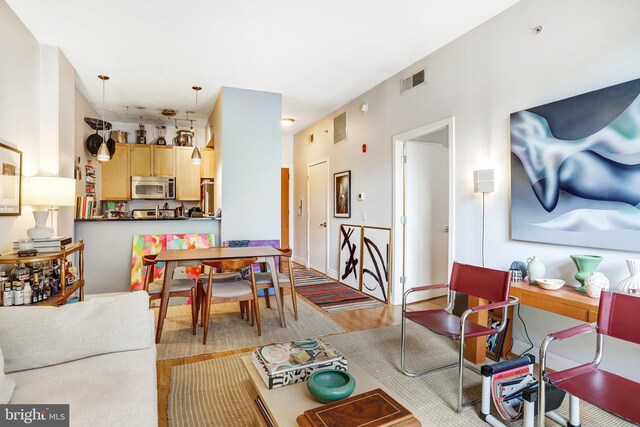 dining room with visible vents and light wood-style floors