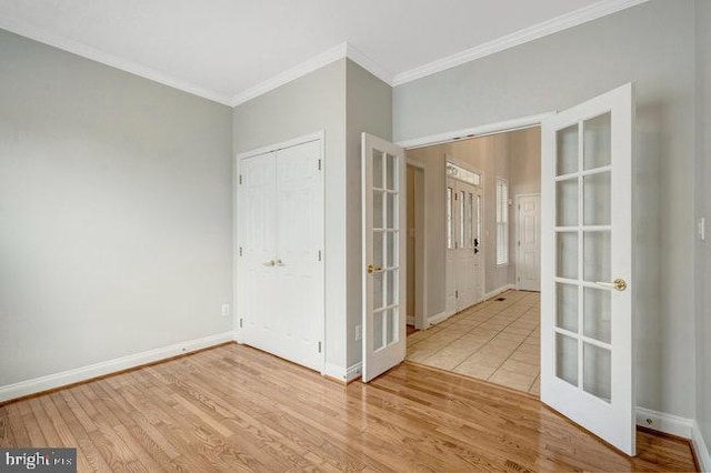 13404 Fieldstone Way, Gainesville, VA 20155 - unfurnished room with french doors, crown molding, wood finished floors, and baseboards