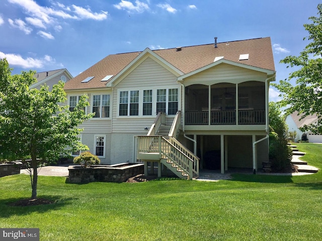 13404 Fieldstone Way, Gainesville, VA 20155 - rear view of house with a sunroom, stairway, a yard, and roof with shingles