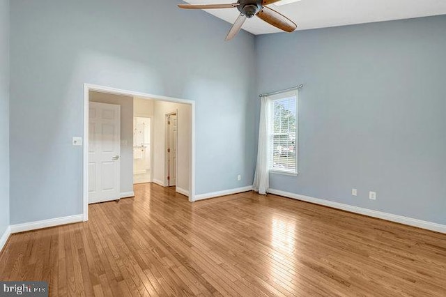 13404 Fieldstone Way, Gainesville, VA 20155 - unfurnished bedroom with wood finished floors, baseboards, and high vaulted ceiling