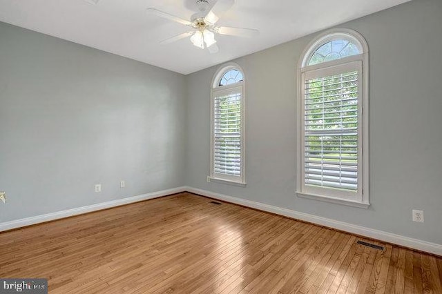 13404 Fieldstone Way, Gainesville, VA 20155 - spare room with plenty of natural light, hardwood / wood-style floors, baseboards, and ceiling fan