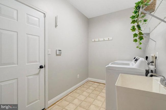 13404 Fieldstone Way, Gainesville, VA 20155 - laundry area with separate washer and dryer, baseboards, and light floors