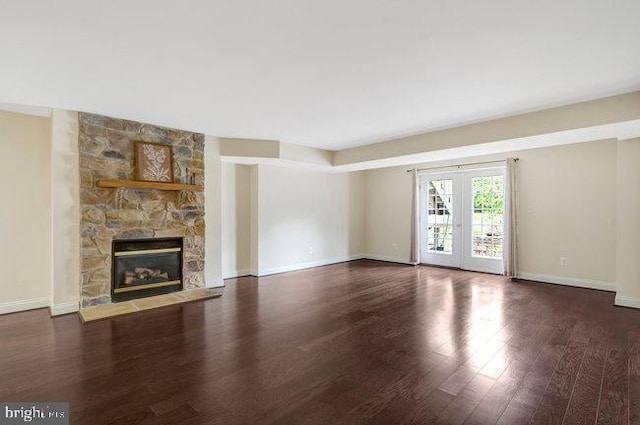 13404 Fieldstone Way, Gainesville, VA 20155 - unfurnished living room with dark wood finished floors, a fireplace, baseboards, and french doors