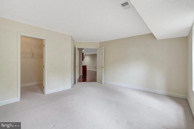 13404 Fieldstone Way, Gainesville, VA 20155 - unfurnished bedroom featuring carpet flooring, a walk in closet, baseboards, and a closet