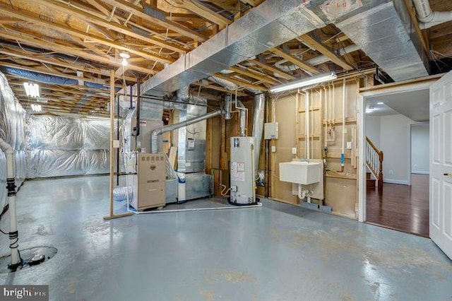 13404 Fieldstone Way, Gainesville, VA 20155 - unfinished basement featuring water heater, a sink, and stairway