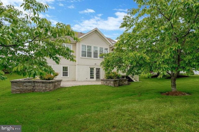 13404 Fieldstone Way, Gainesville, VA 20155 - rear view of property featuring a yard, a patio, and french doors