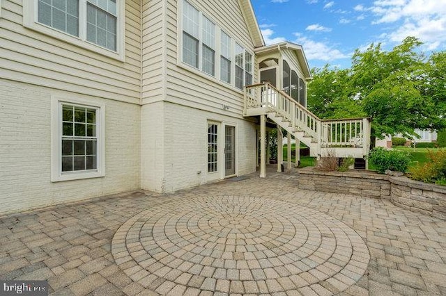 13404 Fieldstone Way, Gainesville, VA 20155 - view of patio / terrace featuring stairs and a sunroom
