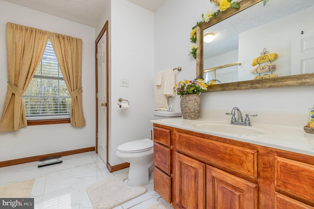 full bath with baseboards, toilet, a textured ceiling, marble finish floor, and a shower with shower door