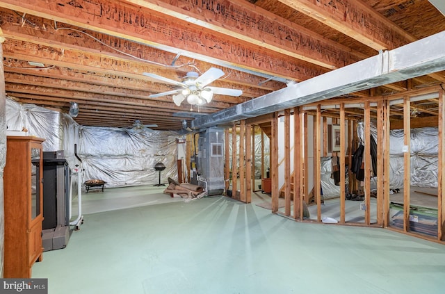 unfinished below grade area featuring ceiling fan