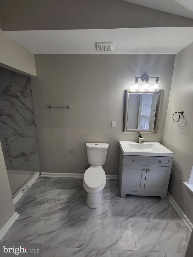 full bath featuring vanity, baseboards, a stall shower, visible vents, and marble finish floor