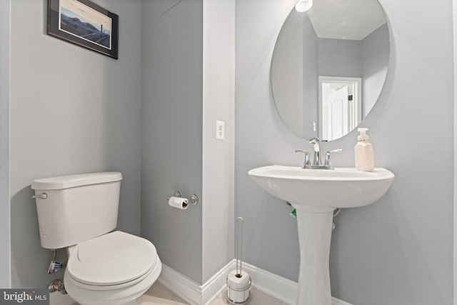 2068 Capstone, Herndon, VA 20170 - half bathroom featuring toilet and baseboards