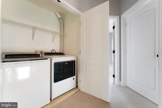 2068 Capstone, Herndon, VA 20170 - laundry room featuring washing machine and clothes dryer and light tile patterned floors