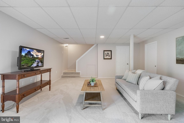 living area with stairway, recessed lighting, carpet flooring, and a drop ceiling