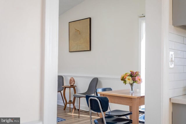 office area with wood finished floors and wainscoting