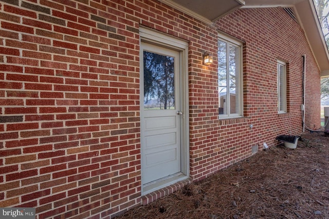 exterior space with brick siding