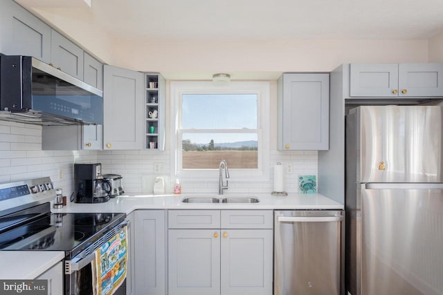kitchen featuring a sink, light countertops, tasteful backsplash, and appliances with stainless steel finishes