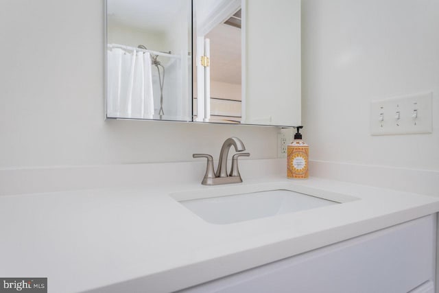 full bathroom with vanity and a shower with curtain