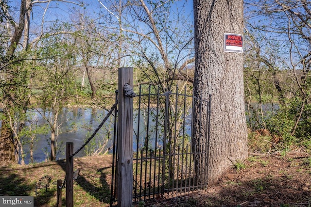 view of gate with fence
