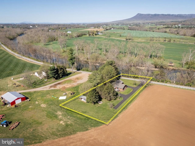 drone / aerial view with a mountain view and a rural view