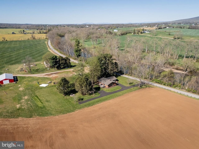 birds eye view of property with a rural view
