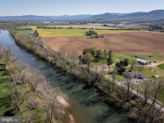 birds eye view of property with a rural view and a water and mountain view