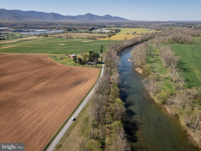 birds eye view of property with a mountain view and a rural view