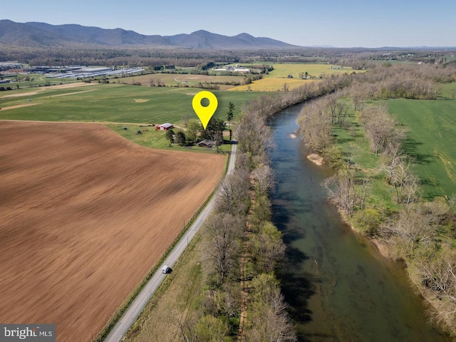 drone / aerial view featuring a rural view and a mountain view