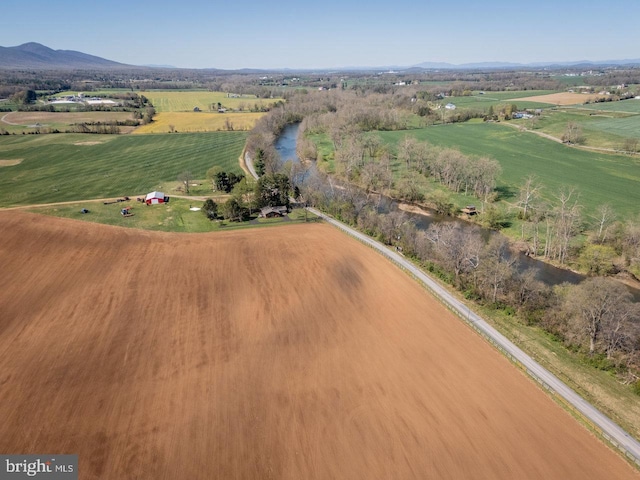 birds eye view of property featuring a rural view and a mountain view