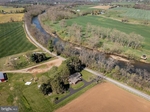 bird's eye view featuring a rural view and a water view