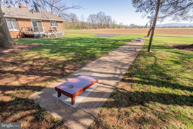 view of property's community with a lawn