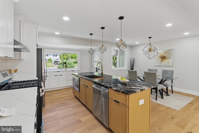 4838 Randolph Dr, Annandale, VA 22003 - kitchen featuring range hood, recessed lighting, a sink, light wood-style flooring, and stainless steel appliances