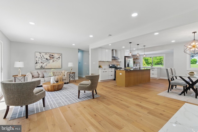4838 Randolph Dr, Annandale, VA 22003 - living area with light wood-style floors, recessed lighting, baseboards, and a chandelier