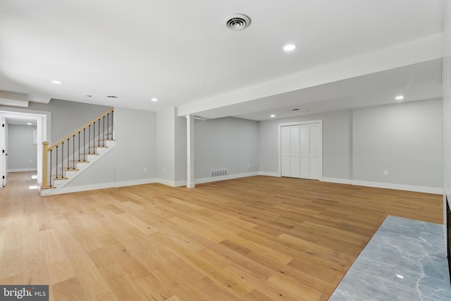 4838 Randolph Dr, Annandale, VA 22003 - finished basement with recessed lighting, visible vents, light wood finished floors, and stairway