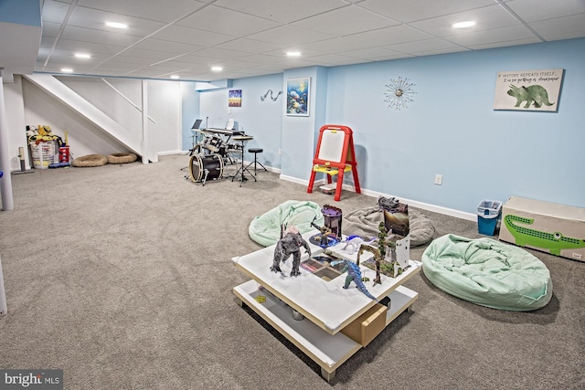 recreation room with baseboards, a drop ceiling, carpet, and recessed lighting