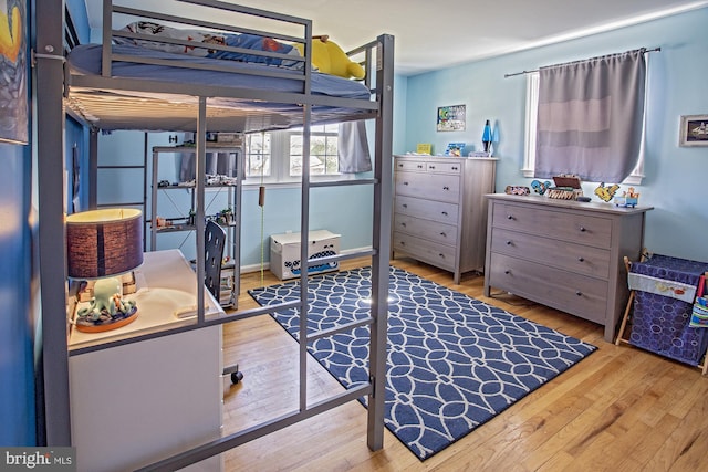 bedroom with wood finished floors