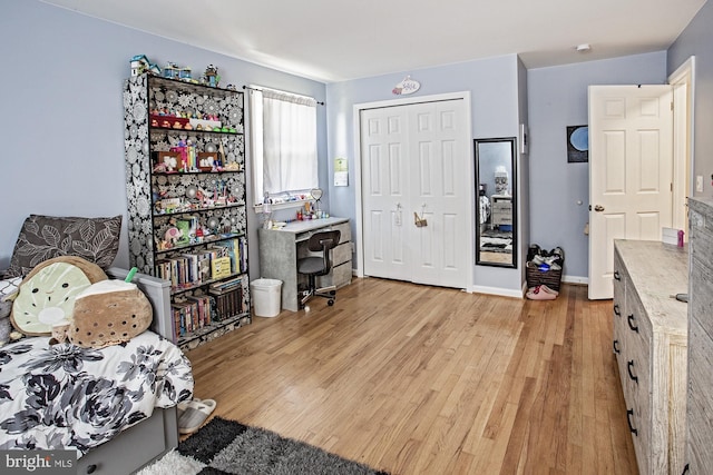 interior space with light wood-style flooring and baseboards
