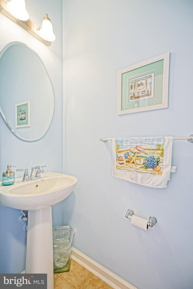 bathroom with tile patterned floors and baseboards