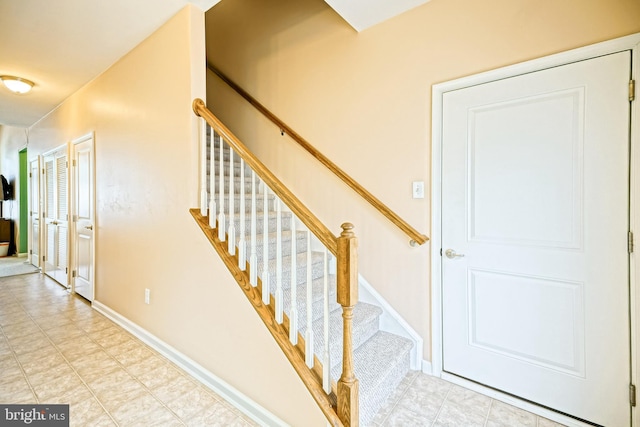 stairs featuring baseboards