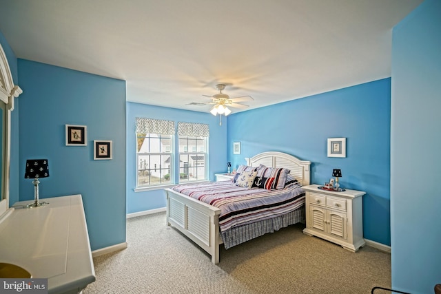 bedroom featuring ceiling fan, carpet flooring, and baseboards