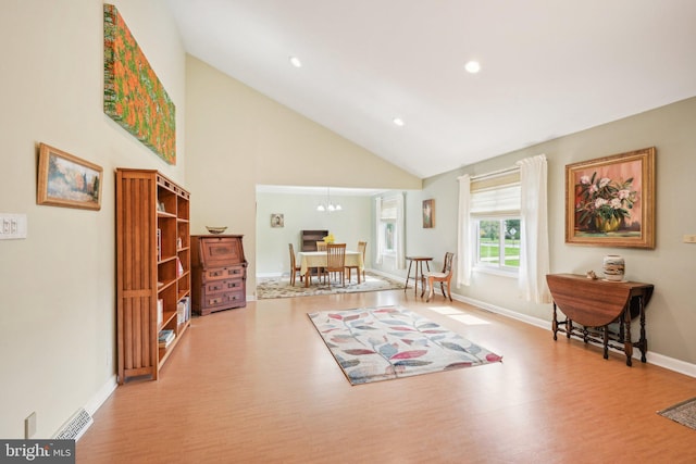 205 S Lehigh Rd, Glassboro, NJ 08028 - living area featuring recessed lighting, wood finished floors, baseboards, high vaulted ceiling, and a notable chandelier
