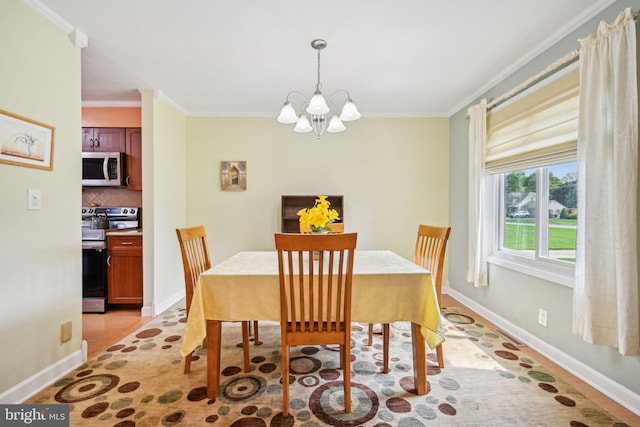 205 S Lehigh Rd, Glassboro, NJ 08028 - dining area featuring an inviting chandelier, crown molding, and baseboards