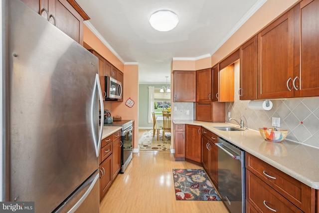 205 S Lehigh Rd, Glassboro, NJ 08028 - kitchen with appliances with stainless steel finishes, brown cabinets, light countertops, and backsplash