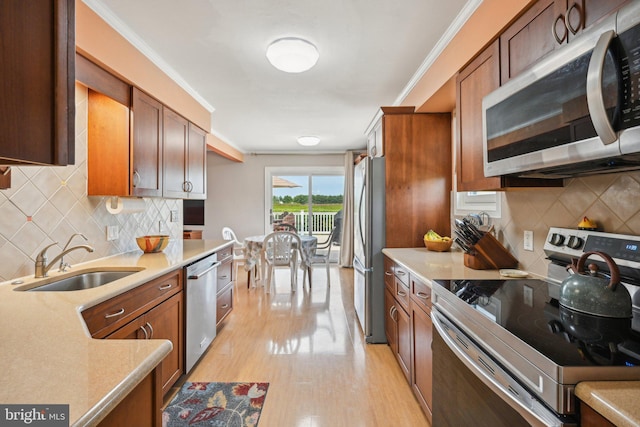 205 S Lehigh Rd, Glassboro, NJ 08028 - kitchen featuring light wood-style floors, stainless steel appliances, backsplash, and a sink
