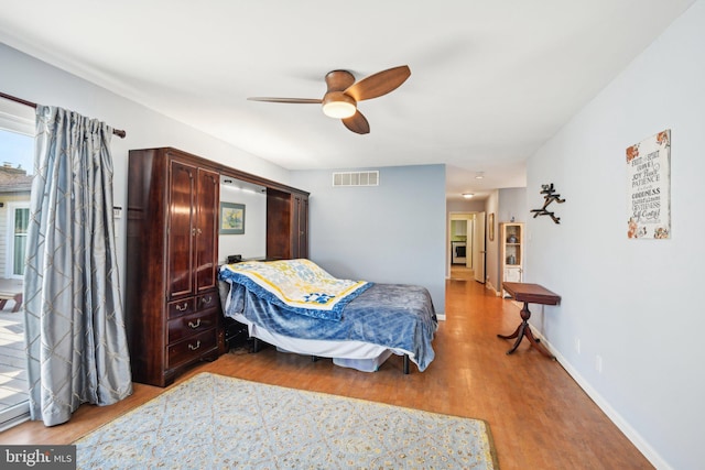 205 S Lehigh Rd, Glassboro, NJ 08028 - bedroom with wood finished floors, visible vents, a ceiling fan, and baseboards