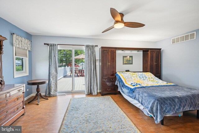 205 S Lehigh Rd, Glassboro, NJ 08028 - bedroom with wood finished floors, access to outside, baseboards, visible vents, and a ceiling fan