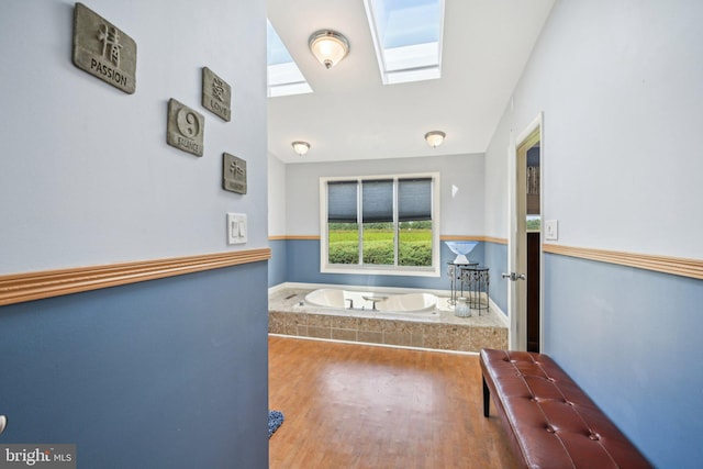 205 S Lehigh Rd, Glassboro, NJ 08028 - full bath with wood finished floors, a bath, and a skylight