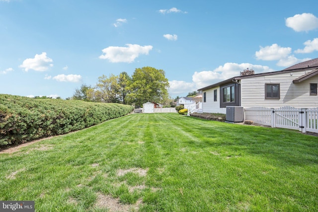 205 S Lehigh Rd, Glassboro, NJ 08028 - view of yard with an outdoor structure, a gate, a shed, central AC unit, and a fenced backyard