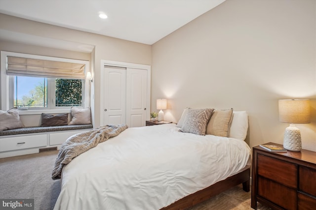 carpeted bedroom with recessed lighting, a closet, and visible vents