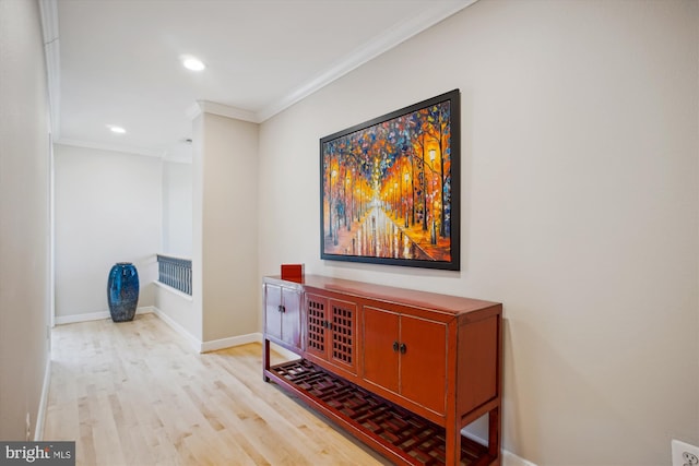 interior space featuring recessed lighting, baseboards, ornamental molding, and light wood-type flooring